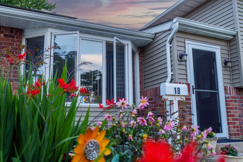 Middle income home on street with natural light showing front of house