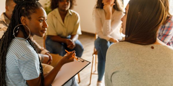 Group therapy session with attentive participants.