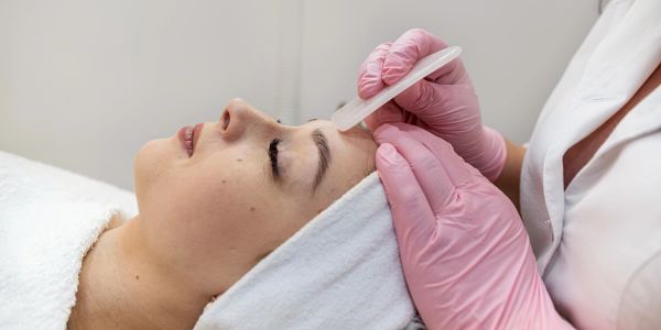 Woman getting a facial skincare treatment.