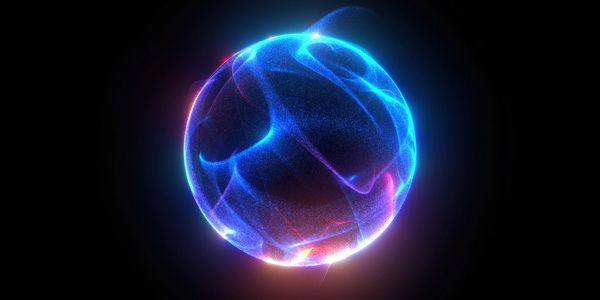 A glowing, abstract blue and purple energy sphere against a black background.