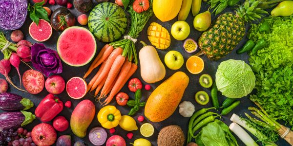 A vibrant assortment of fresh fruits and vegetables arranged neatly.