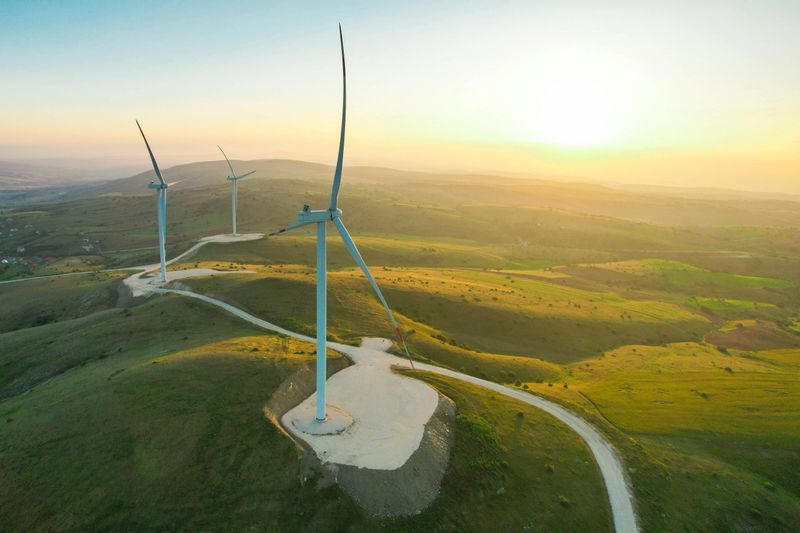 wind turbines at sunset, renewable energy source