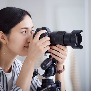 Woman using a professional camera to take an image.
