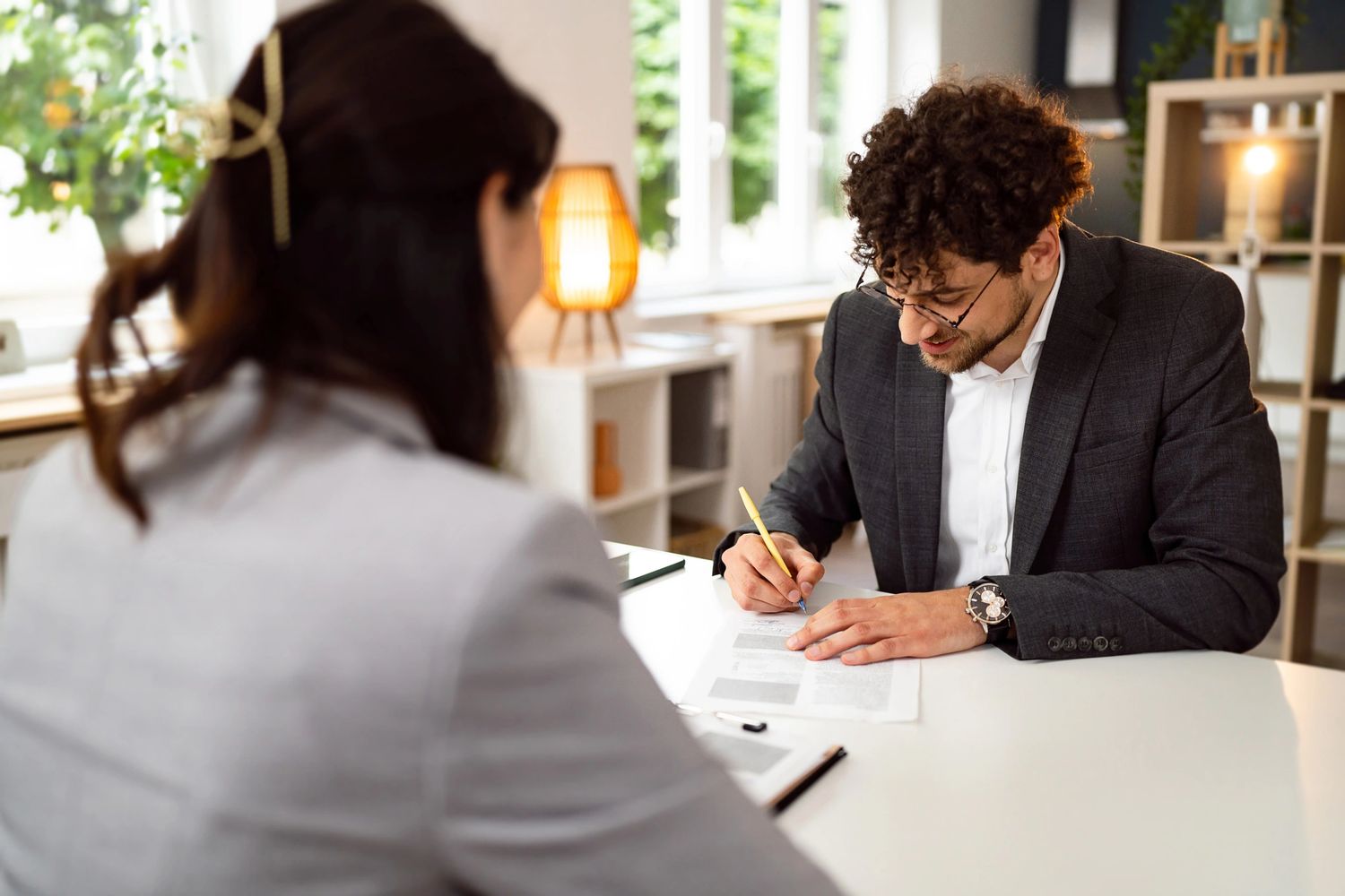 Mobile notary assisting a client with document signing.
