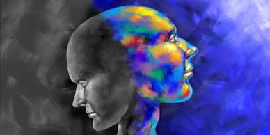 Two faces in profile, one monochrome and one colorful, merging into one head.