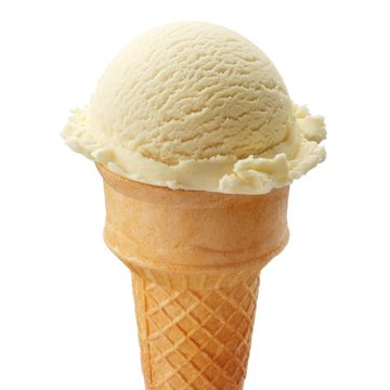 A single scoop of vanilla ice cream in a waffle cone.
