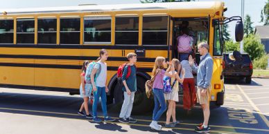 Children boarding a school bus.
