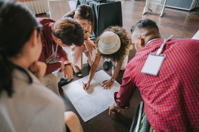Multi Ethnic group of young entrepreneur participate in business conference workshop brainstorming with creative ideas and concept