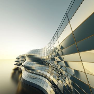 Futuristic building with flowing glass panels reflecting light.