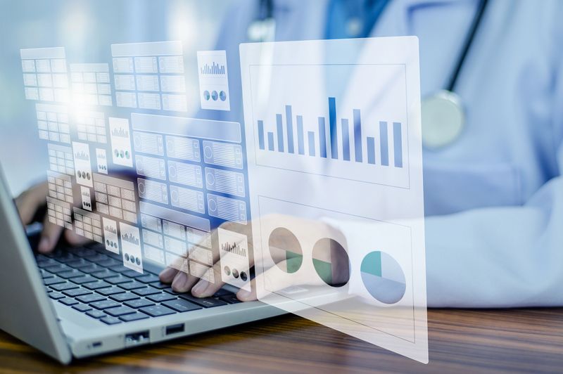 Doctor using computer Document Management System (DMS), online documentation database process automation to efficiently manage files