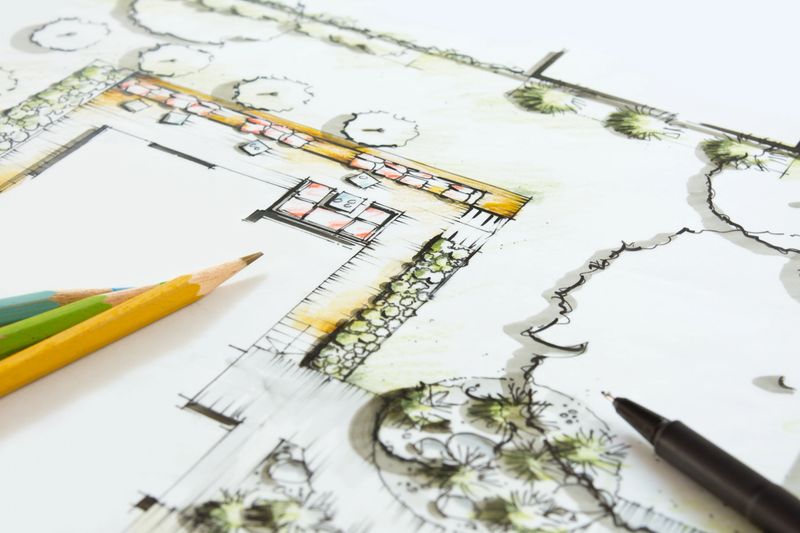 Landscape Architecture - Blueprint for a private Garten. Crayons and Pen lying on the Plan. Idea and Drawing is my own Work (Andreas Krappweis Private Gardens), Building, Ground and Garden is fictitious.