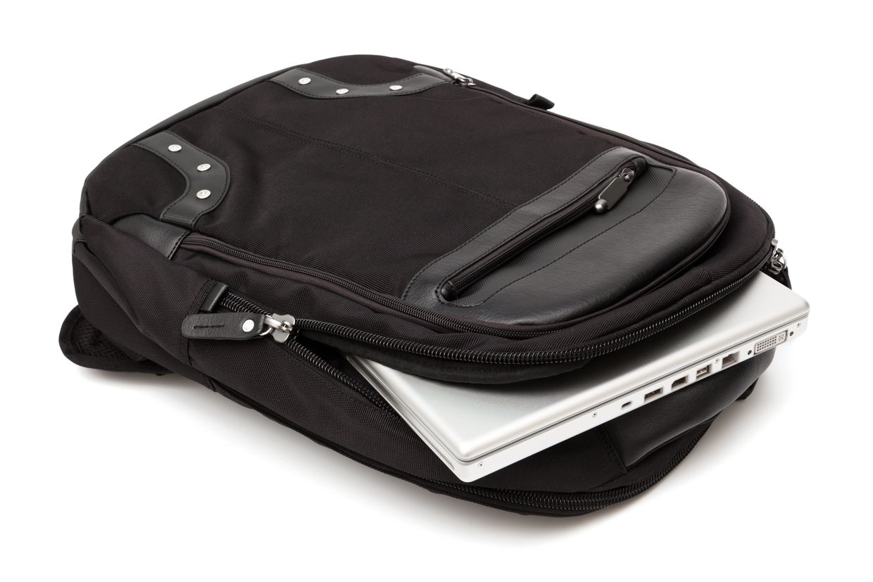 Black laptop bag with a silver laptop inside.