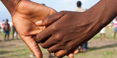Picture of two people holding hands-Haiti