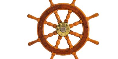 Wooden ship steering wheel with brass center.