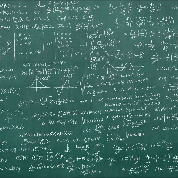 Complex mathematical equations on a chalkboard.