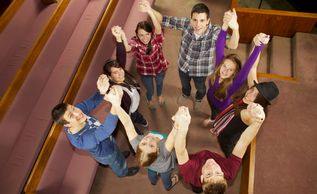 Young adults in prayer.
