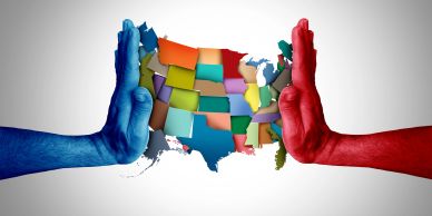 Two hands painted red and blue framing a colorful US map.