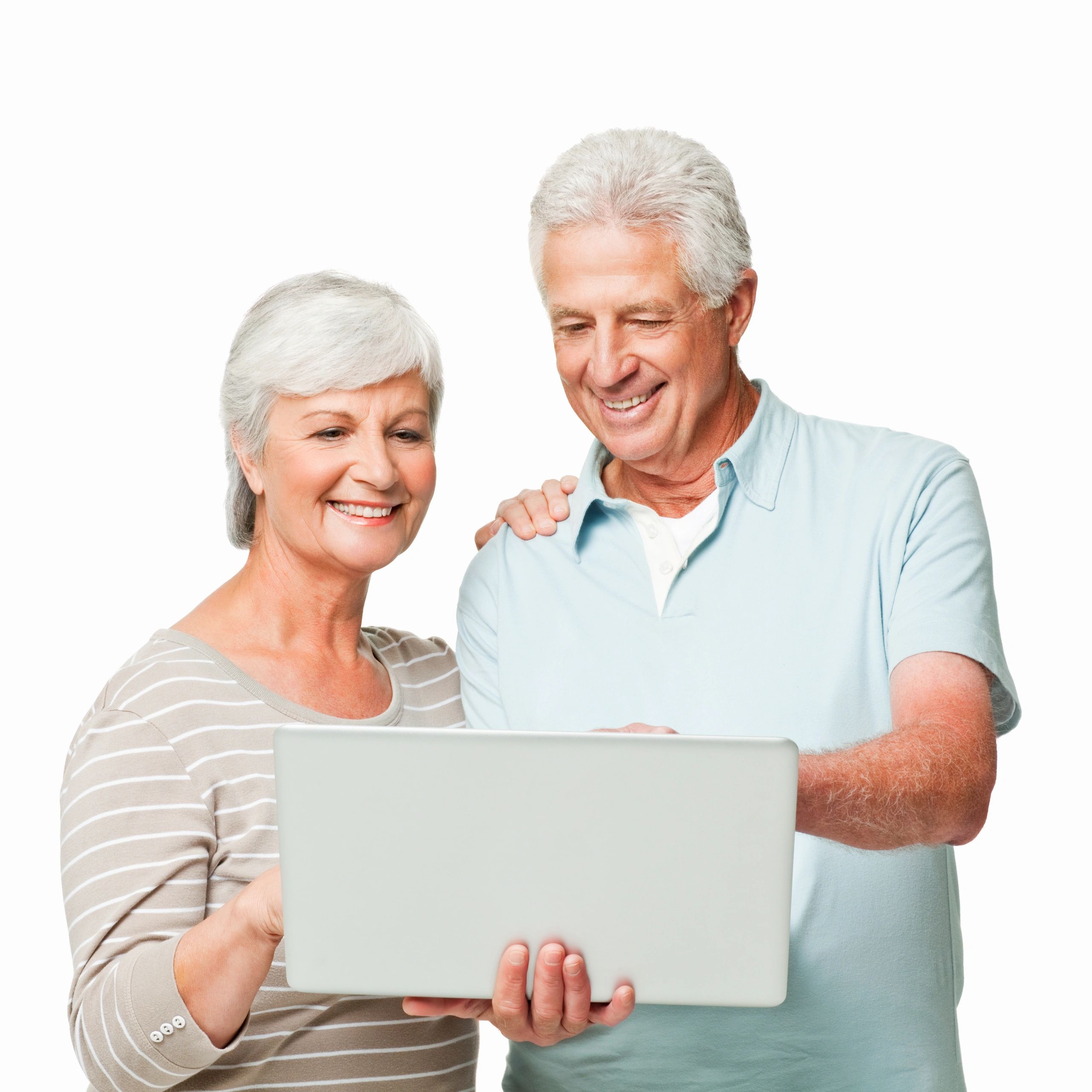 Happy elderly couple looking at a laptop together.