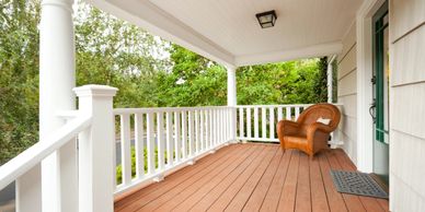 Front porch with wood decking and white railings for a Los Gatos home.