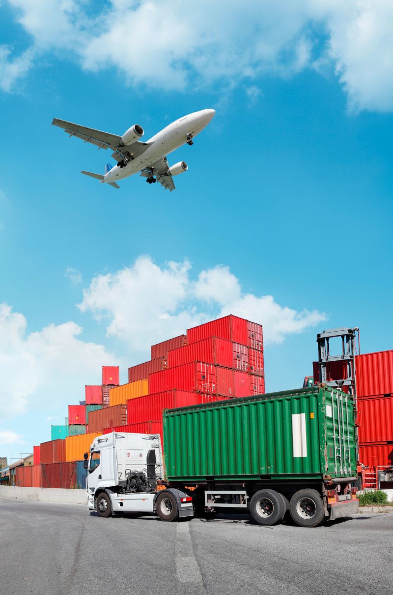 Global transport: truck with cargo container and flying airplane. See my other similar photos: :  http://www.oc-photo.net/FTP/icons/cargo.jpg