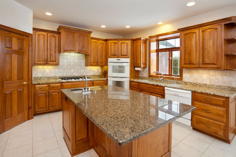 Dream Kitchen With Granite Counters, Hardwood Cabinetry, Custom Lighting