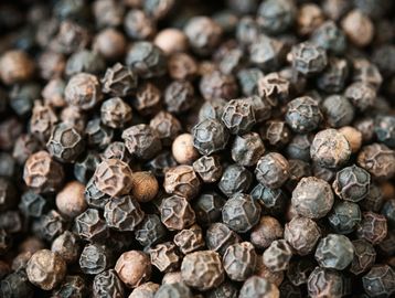 Close-up of black peppercorns.