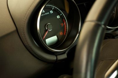 Close-up of a car tachometer showing RPM.