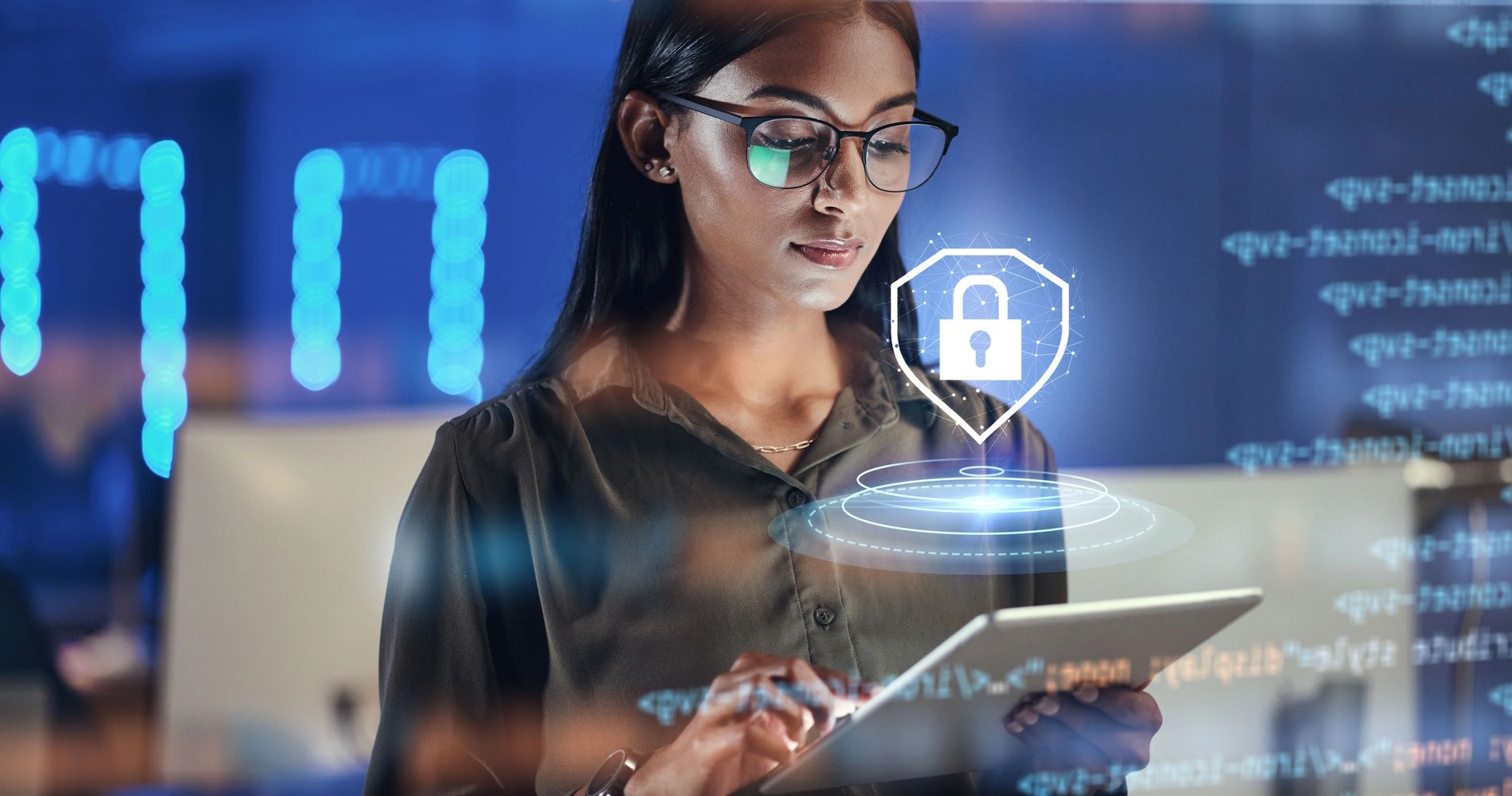 Woman using a tablet with digital cybersecurity icons and code overlays.