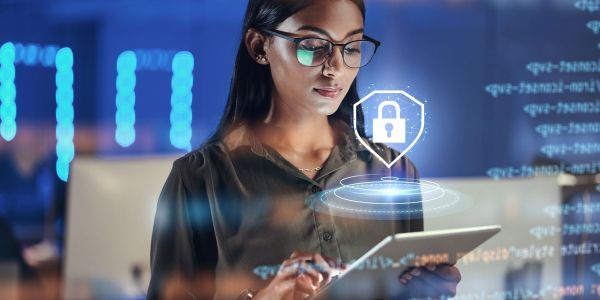 Woman using tablet with digital security interface.
