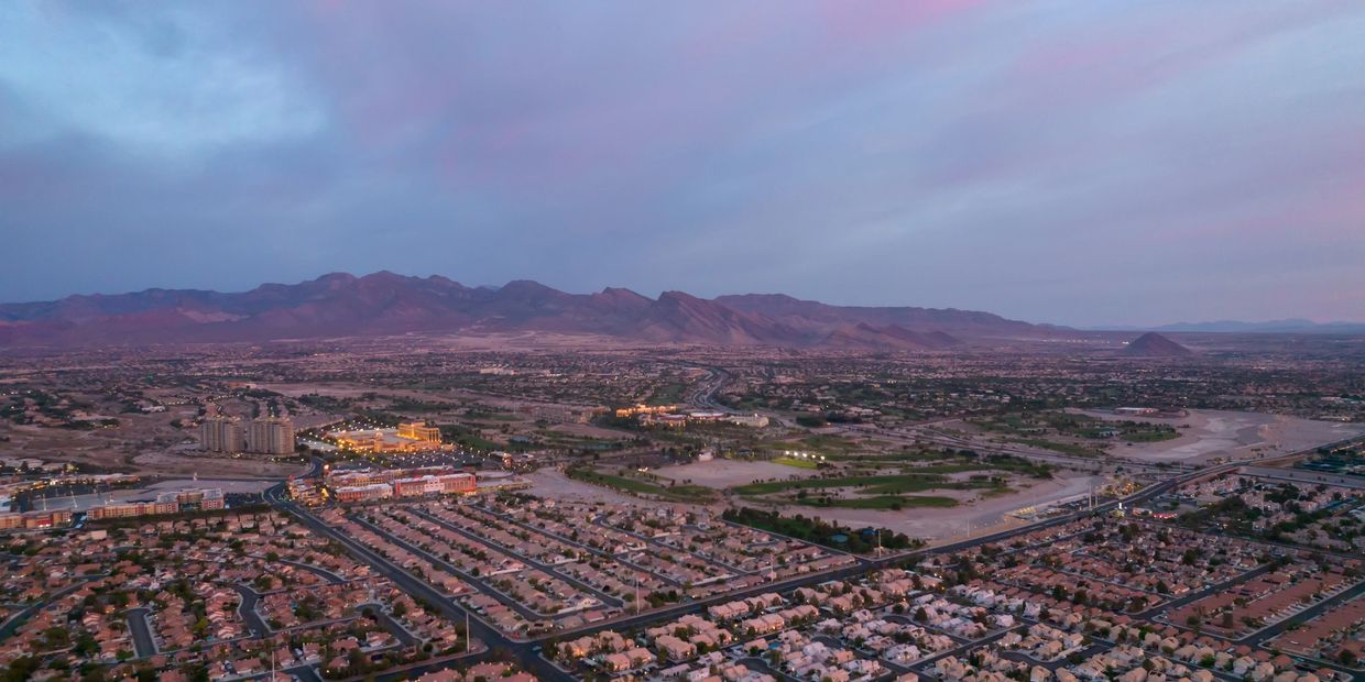 A view of the city from above at dusk.