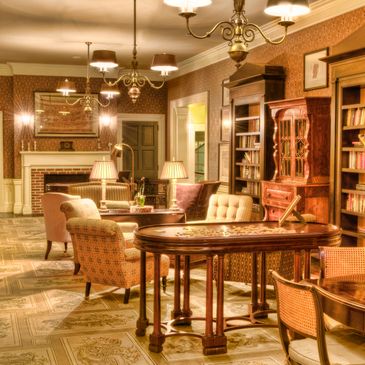 Warm, vintage-style living room with classic furniture and soft lighting.