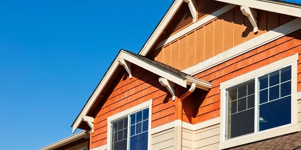 residential siding showing board and batten, shingle siding, lap siding, fascia, dormers