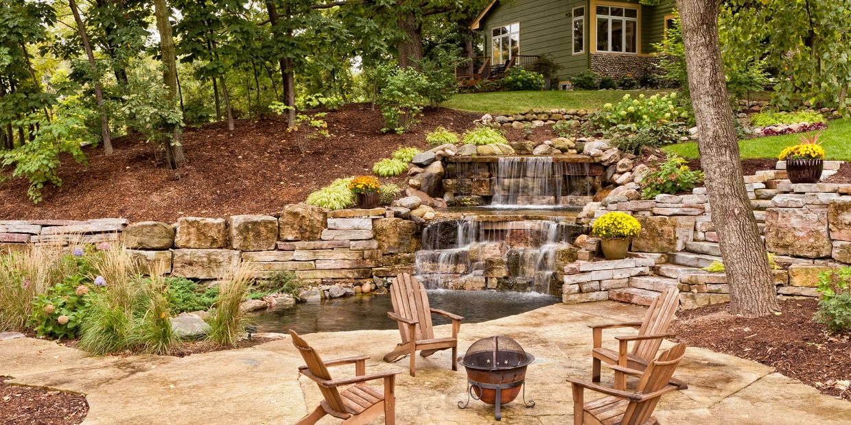 Custom Backyard waterfall and stone retaining wall in Castle Rock, Parker, Elizabeth