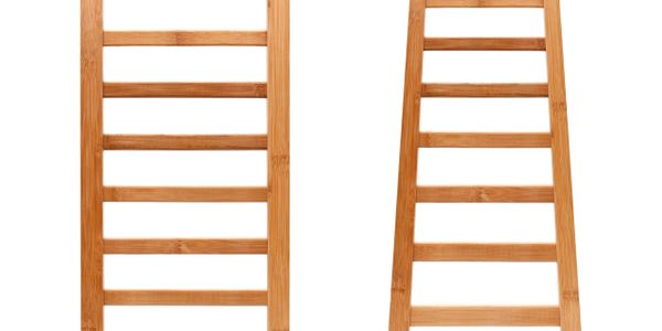 Two wooden ladder-like racks with horizontal slats standing upright.