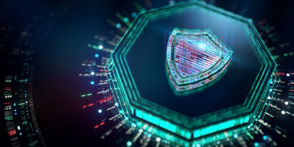 Glowing blue digital shield representing cybersecurity and data protection.