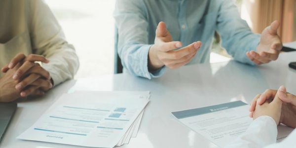 Discussion over a table about Cloud & Data, DevOps, Data & Analytics & Microsoft Dynamics