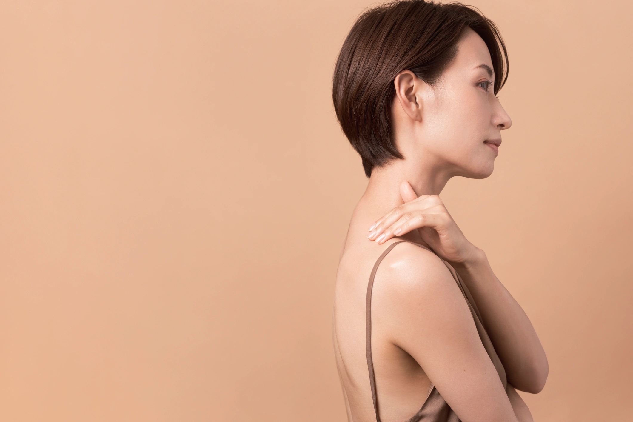 Profile view of a woman showing the jawline and area beneath the chin