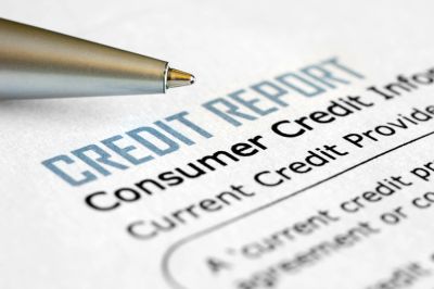 Close-up of a credit report with a pen.