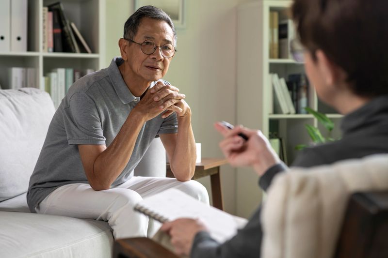 Senior patient with mental health problem talking and consulting therapist