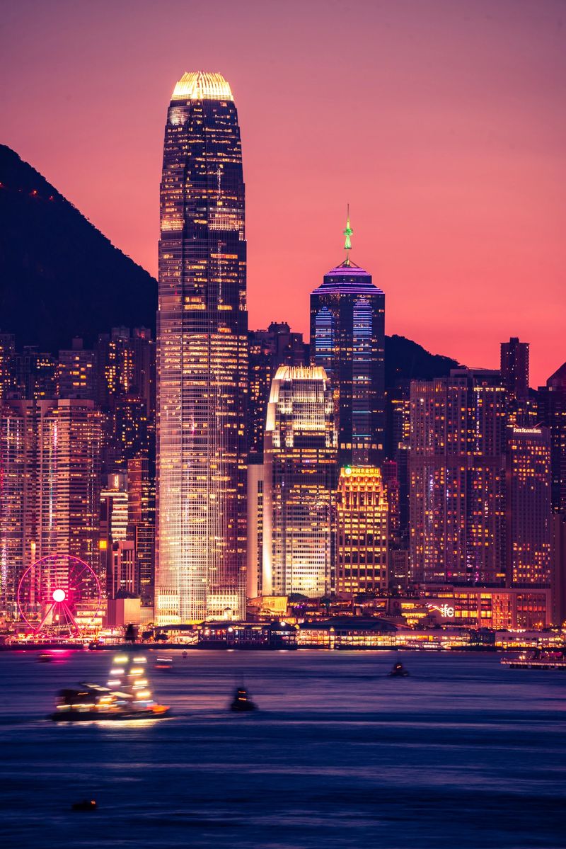 Skyline of Victoria Harbor in Hong Kong city at dusk