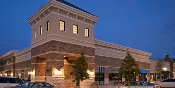 Person signing a document during a formal meeting.