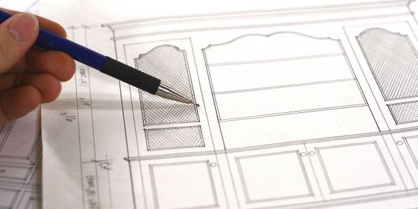 Smooth wooden table with natural edges and contrasting wood strips.