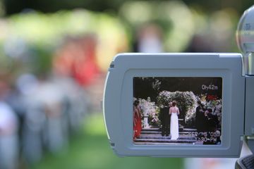 A wedding scene recorded by a camcorder.