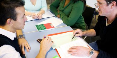 People discussing around a table