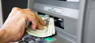 ATM dispensing cash.