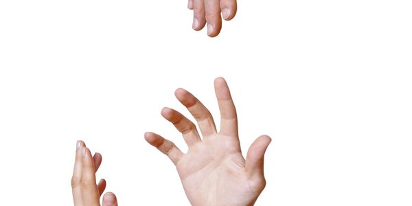 Three hands reaching towards each other against a white background.
