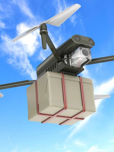 Drone carrying a package against a blue sky.