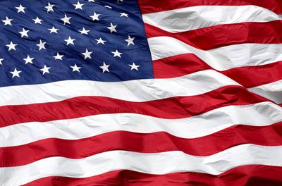 Waving American flag with vibrant red, white, and blue colors.