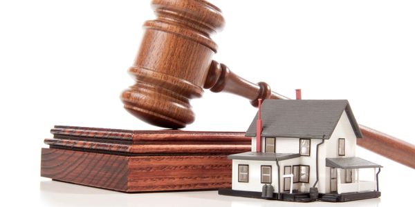 A wooden gavel rests on a document titled 'Family Law'.
