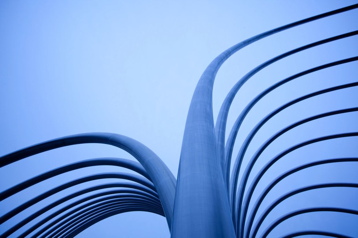 Abstract photo of curved metal structures.